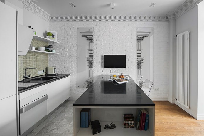 Cuisine avec îlot central et plan de travail noir brillant