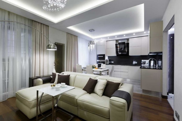 Cuisine-salon 20 m² avec un canapé près de la fenêtre