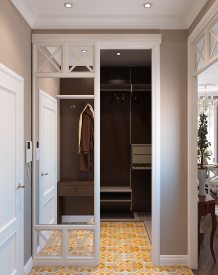 dressing avec portes miroir dans une chambre