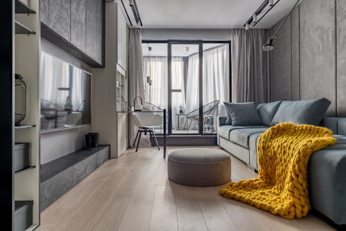 intérieur de salon gris avec une couverture lumineuse