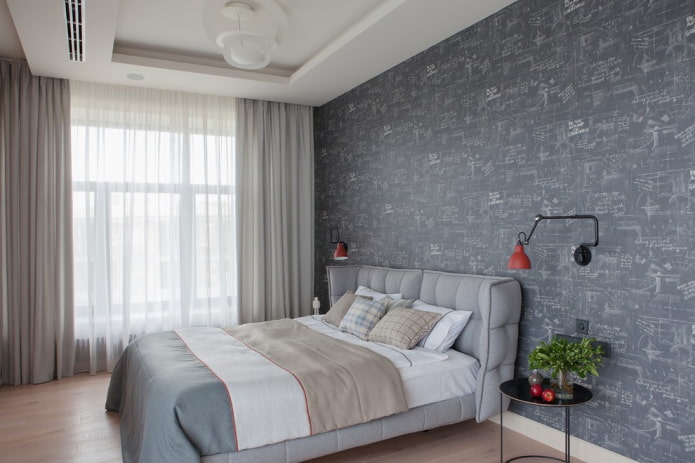 Lit gris à l'intérieur de la chambre