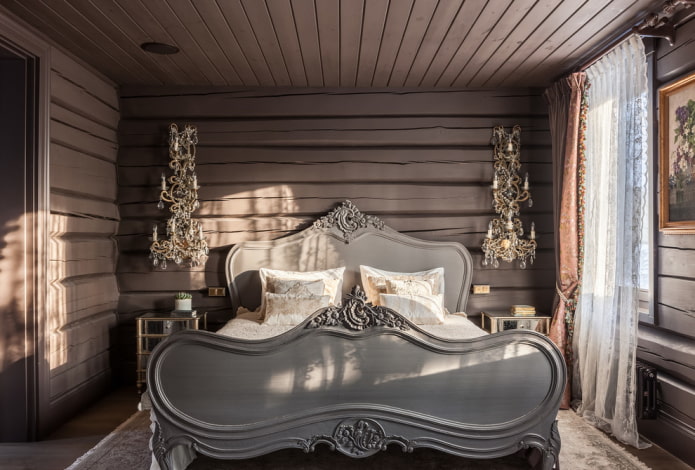 Lit gris à l'intérieur de la chambre