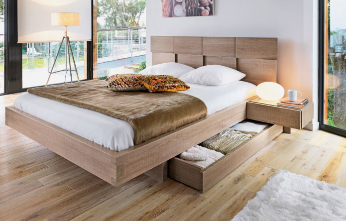 Lit en bois avec tiroirs à l'intérieur