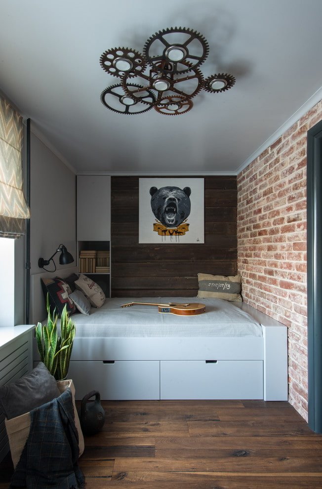 Plafond tendu avec un lustre dans la chambre de bébé