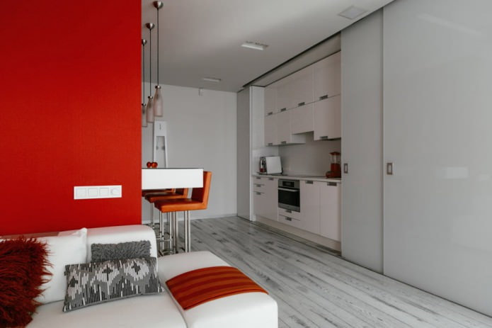 Comptoir de bar à l'intérieur de la cuisine-salon dans les tons blancs et rouges