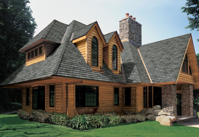 maison en rondins de bois ronds avec toiture souple