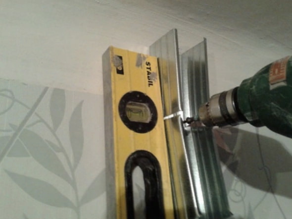 fixation des guides de porte
