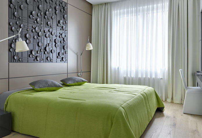 lit avec un couvre-lit vert dans la chambre