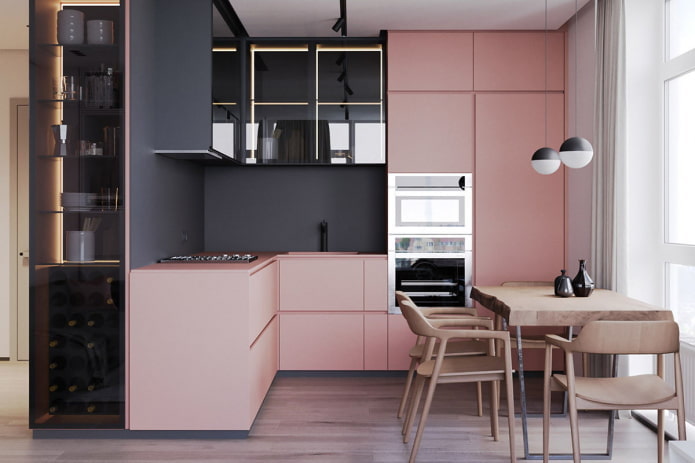 Meubles et appareils électroménagers dans la cuisine aux tons roses