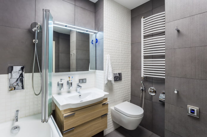 Intérieur de salle de bain dans les tons blancs et gris