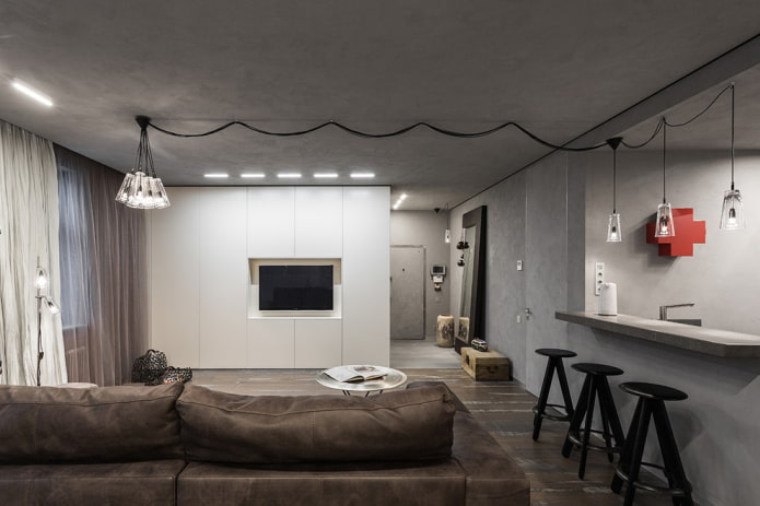meuble avec un téléviseur comme cloison à l'intérieur