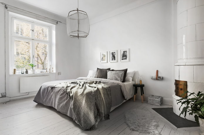 Murs blancs et lit gris