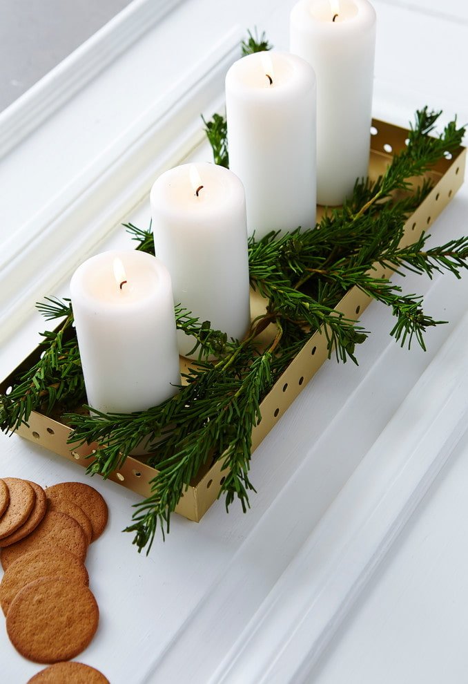 Bougies avec branches de sapin