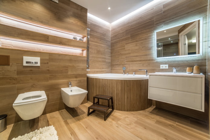 intérieur d'une salle de bain spacieuse avec une vasque d'angle en acrylique