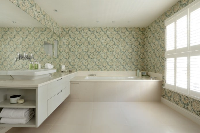 Papier peint avec des monogrammes jaunes et verts sur fond blanc