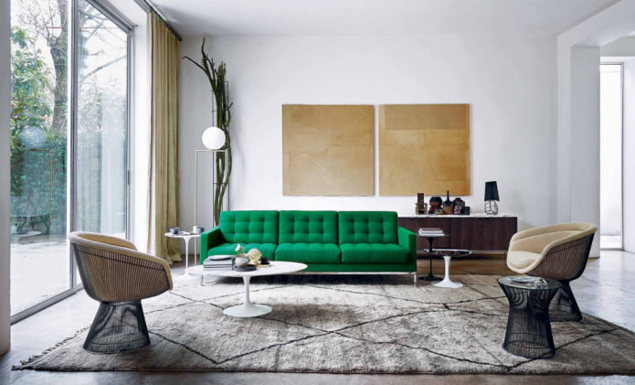 canapé vert associé à des fauteuils